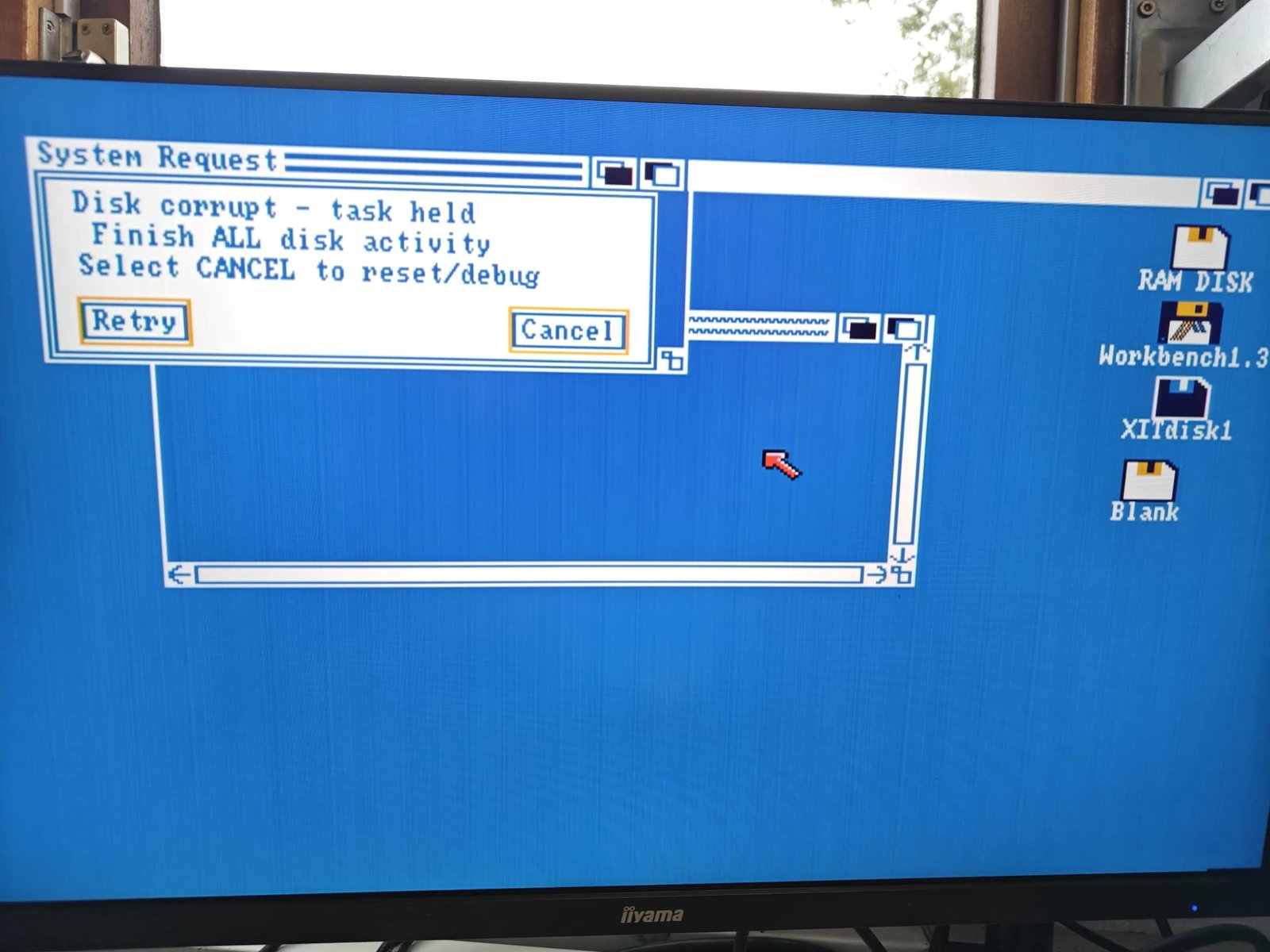 Workbench 1.3 showing a Disk corrupt - task held requester